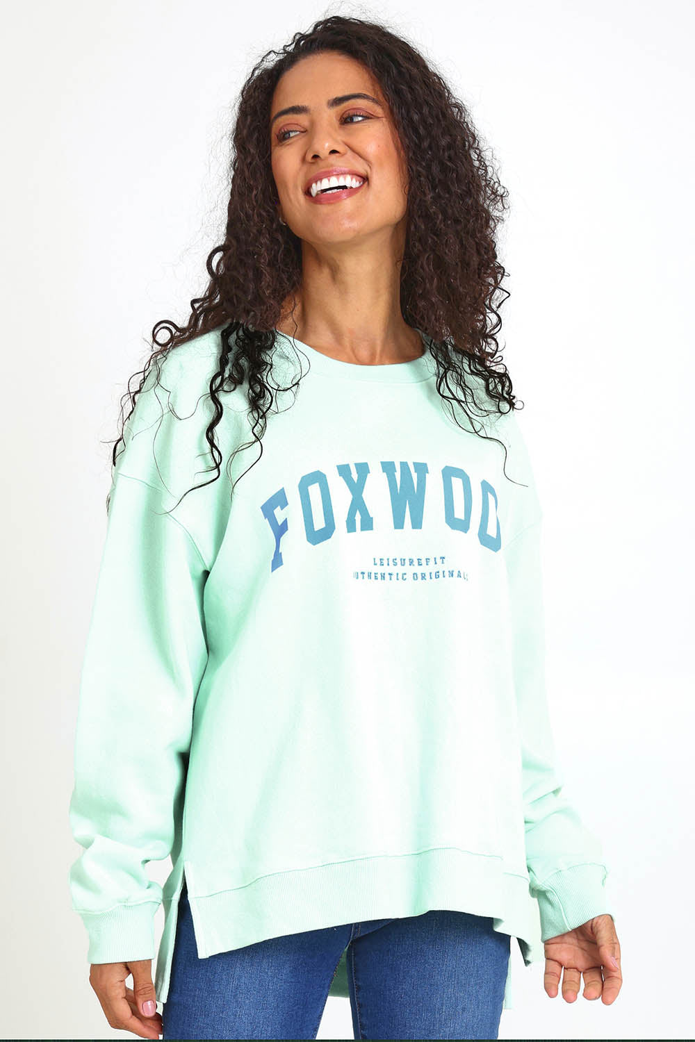 Model Pamelar wearing size 10 of the Elements Interval Cotton Crew – Mint in colour Mint, in a cropped view