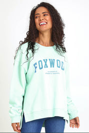 Model Pamelar wearing size 10 of the Elements Interval Cotton Crew – Mint in colour Mint, in a cropped view