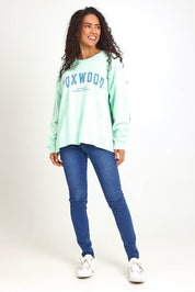 Model Pamelar wearing size 10 of the Elements Interval Cotton Crew – Mint in colour Mint, from the front