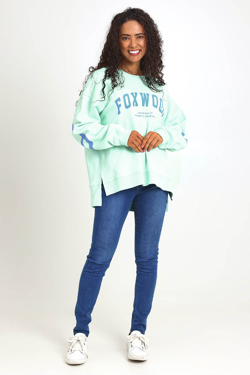 Model Pamelar wearing size 10 of the Elements Interval Cotton Crew – Mint in colour Mint, from the front