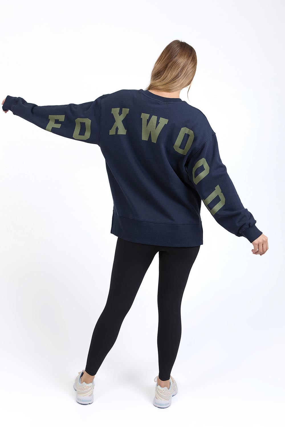 A model wearing the Interval Cotton Crew in colour Navy (Blue), from the back