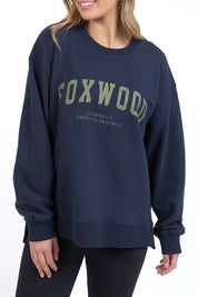 A model wearing the Interval Cotton Crew in colour Navy (Blue), from the front, cropped image