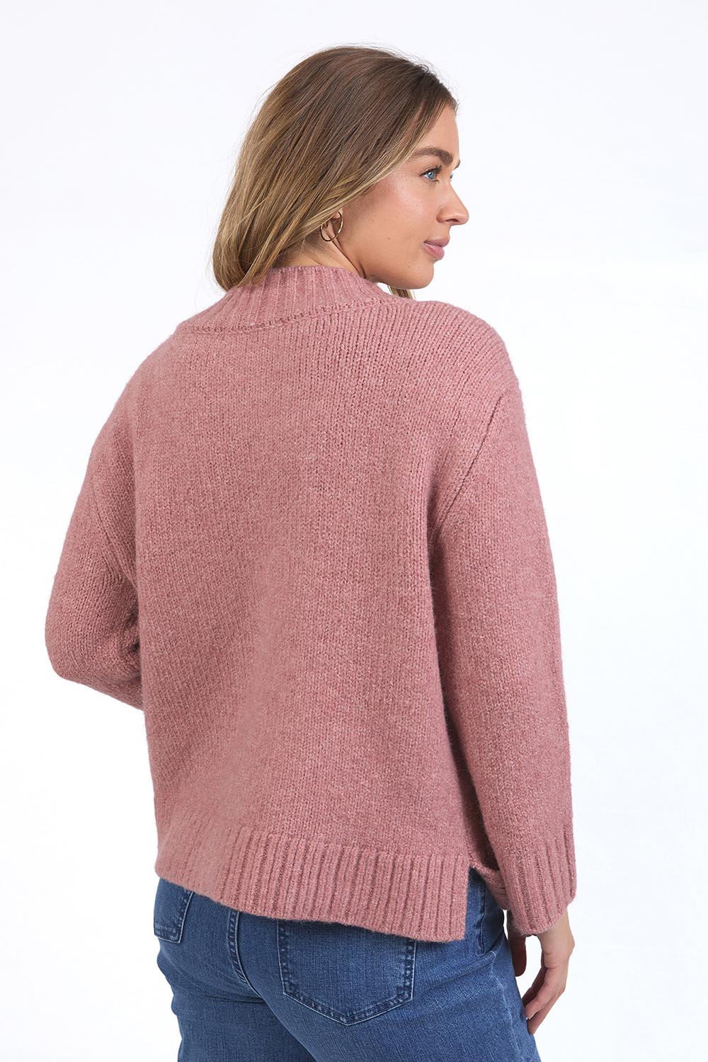 A model wearing the Pepper Knit in colour Rosepink (Pink), from the back