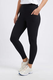 A model wearing the Leisure Luxe Rib Legging in colour Black (Black), from the front, cropped image