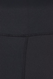 Product shot of the Leisure Luxe Rib Legging in colour Black (Black), detail