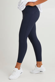 Model Olivia wearing size 10 of the Leisure Luxe Rib Legging in colour Navy (Blue), from the front, cropped image