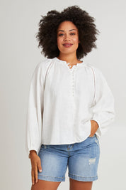 Model Olivia wearing size 10 of the Corsica Blouse in colour Vinwhite (White), from the front, cropped image