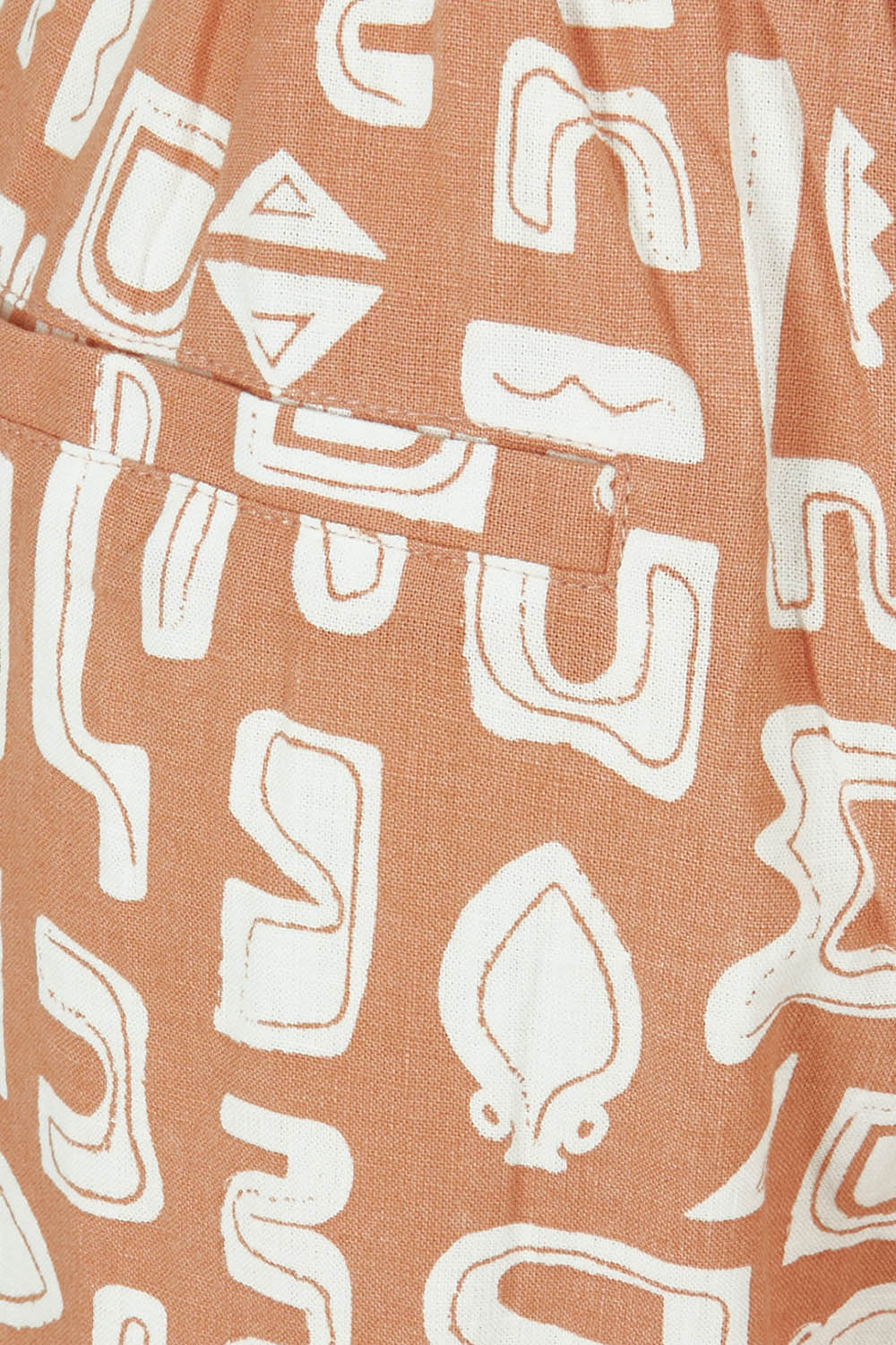 Product shot of the Etched Geo Pant in colour Clay, detail