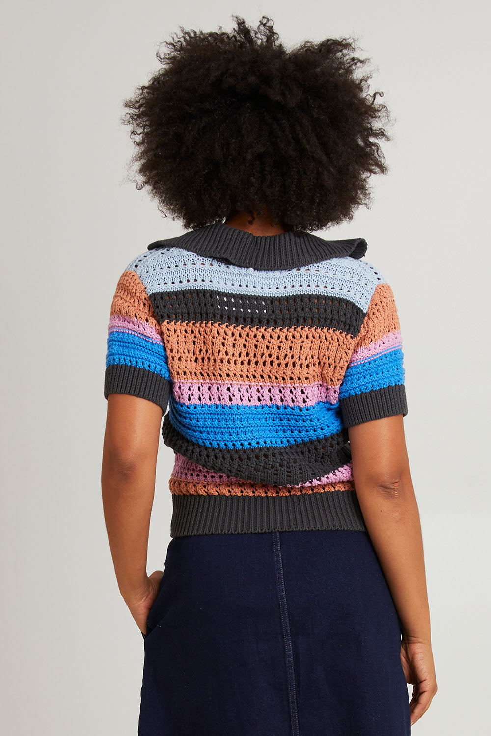 Model Olivia wearing size 10 of the Gazelle Cotton Stripe Knit in colour Multi (Black), from the back