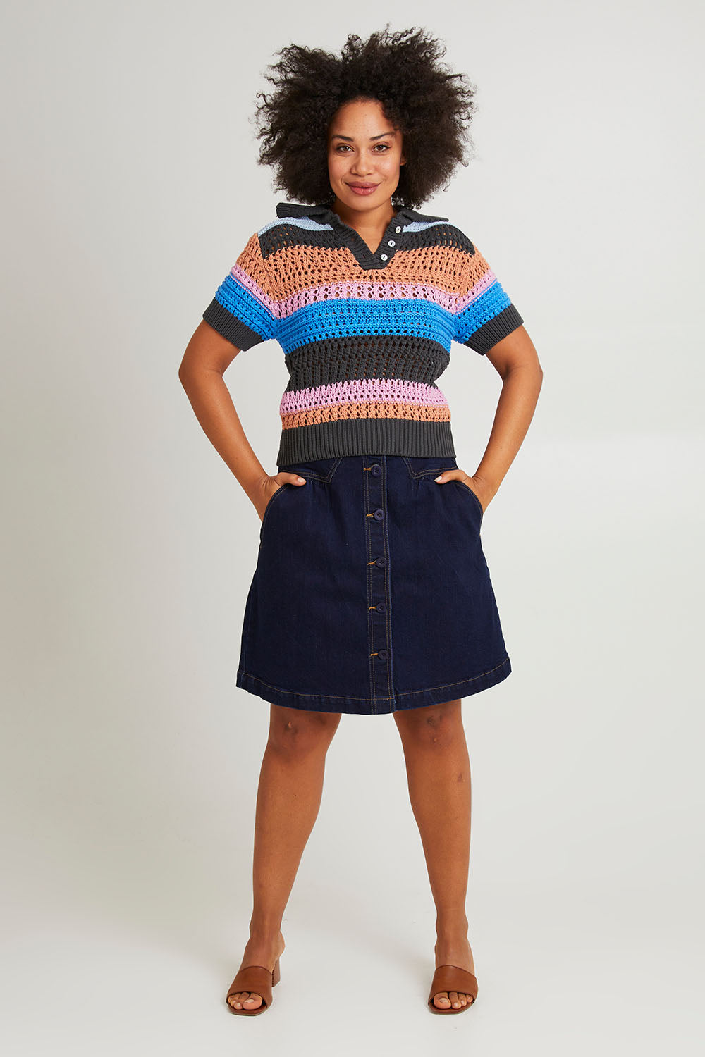 Model Olivia wearing size 10 of the Gazelle Cotton Stripe Knit in colour Multi (Black), from the front, showing the whole outfit