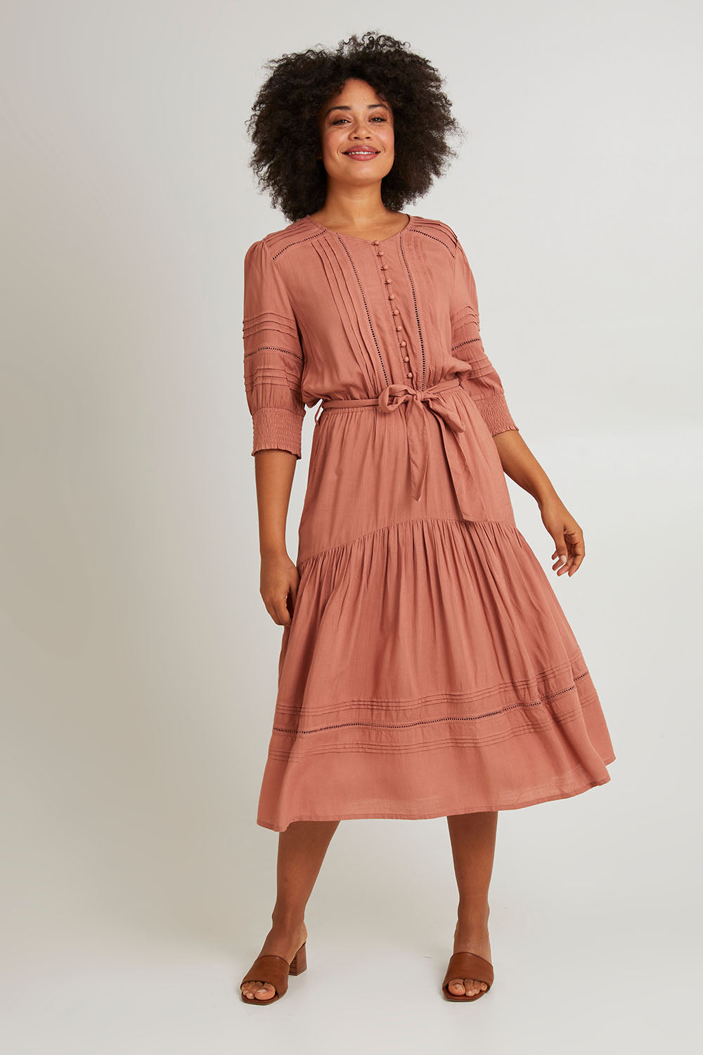 Model Olivia wearing size 10 of Thea Dress in colour Clay, from the front, showing the whole outfit