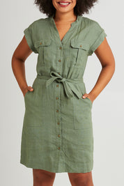 Model Olivia wearing size 10 of the Harlow Dress in colour Khaki (Green), from the front, cropped image