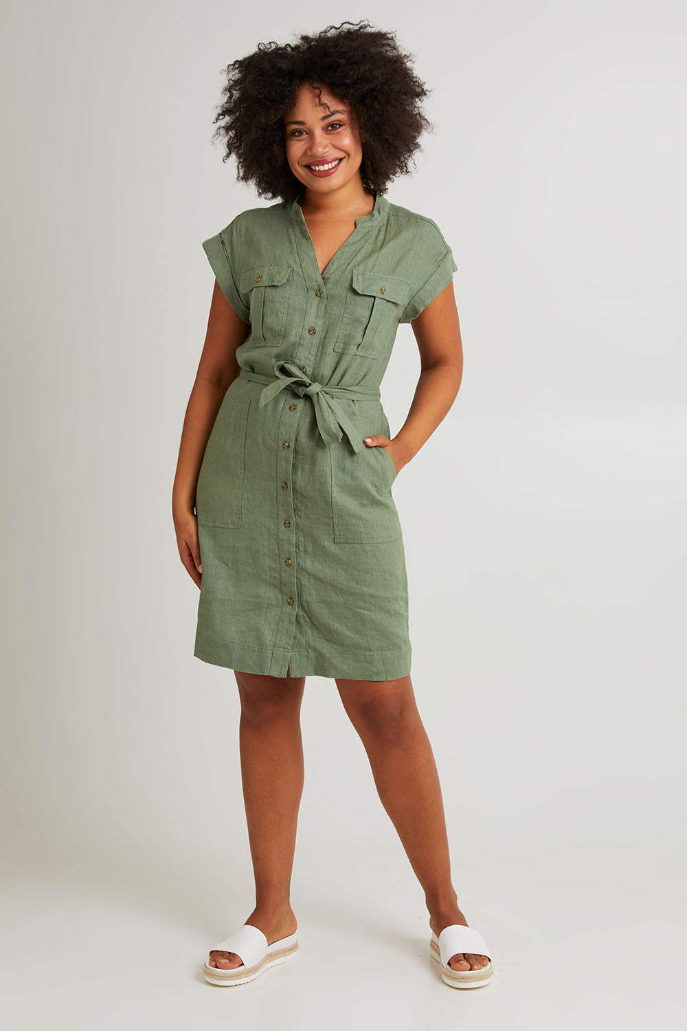 Model Olivia wearing size 10 of the Harlow Dress in colour Khaki (Green), from the front, showing the whole outfit