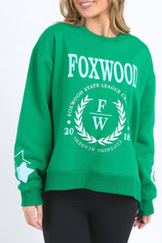 A model wearing the State League Cotton Crew in colour Green (Green), from the front, cropped image