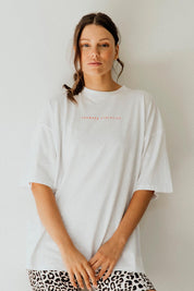 A model wearing the Leisure Captain Cotton Tee in colour White (White), from the front, showing the whole outfit