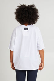 Model Olivia wearing size 10 of the Leisure Captain Cotton Tee in colour White (White), from the back