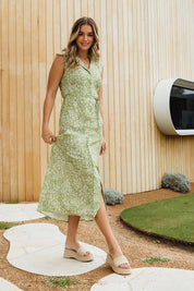 A model wearing the Antayla Floral Dress in colour Lgreen (Green), from the front, showing the whole outfit