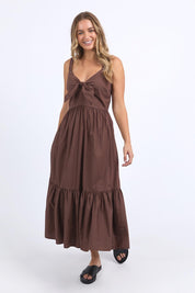 A model wearing the Esmerelda Cotton Dress in colour Chocolate, from the front, showing the whole outfit