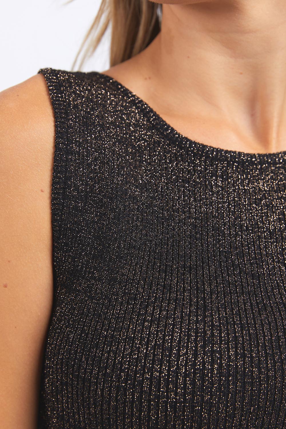 A model wearing the Tessa Metallic Knit Tank in colour Black (Black), from the front, cropped image