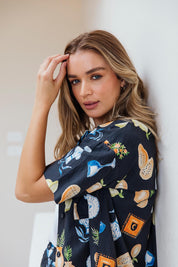 A model wearing the Italian Summer Linen Blend Shirt in colour Print (Black), from the front, showing the whole outfit
