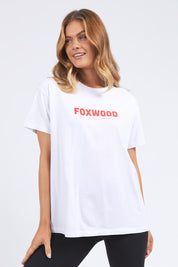 A model wearing the Leisure Overload Cotton Tee in colour White (White), from the front, cropped image