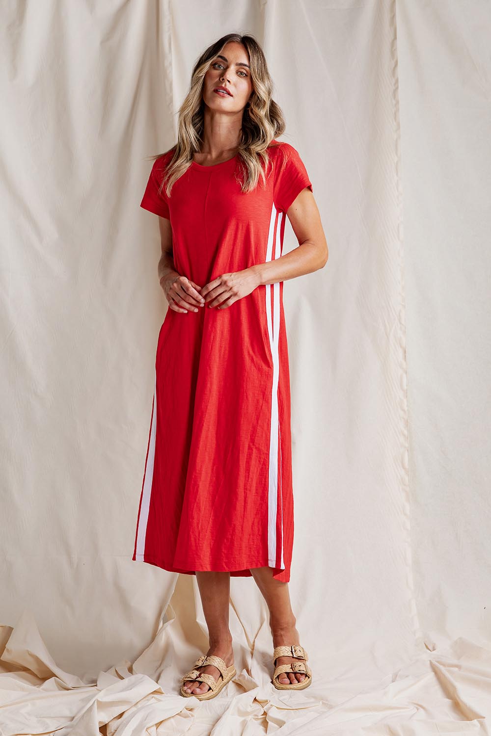 A model wearing the Leisure Recovery Cotton Dress in colour Red (Red), from the front, showing the whole outfit
