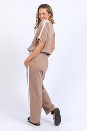 A model wearing the Leisure Power Cotton Pant in colour Mocha, from the back