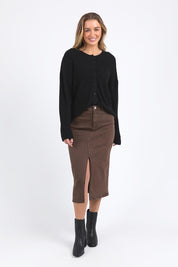 A model wearing the Murphy Knit Cardigan in colour Black (Black), from the front, showing the whole outfit