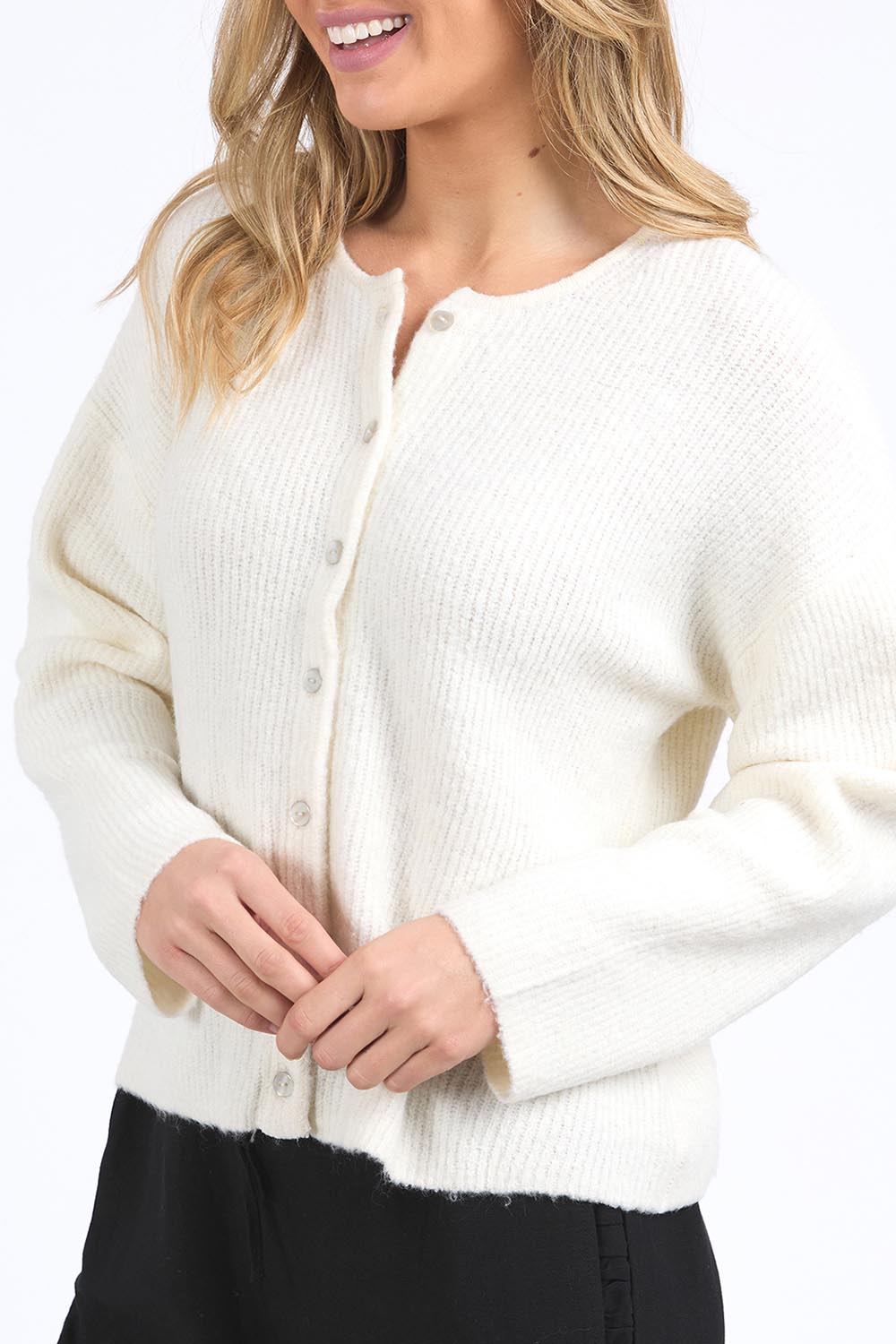 A model wearing the Murphy Knit Cardigan in colour Vinwhite (White), from the front, cropped image