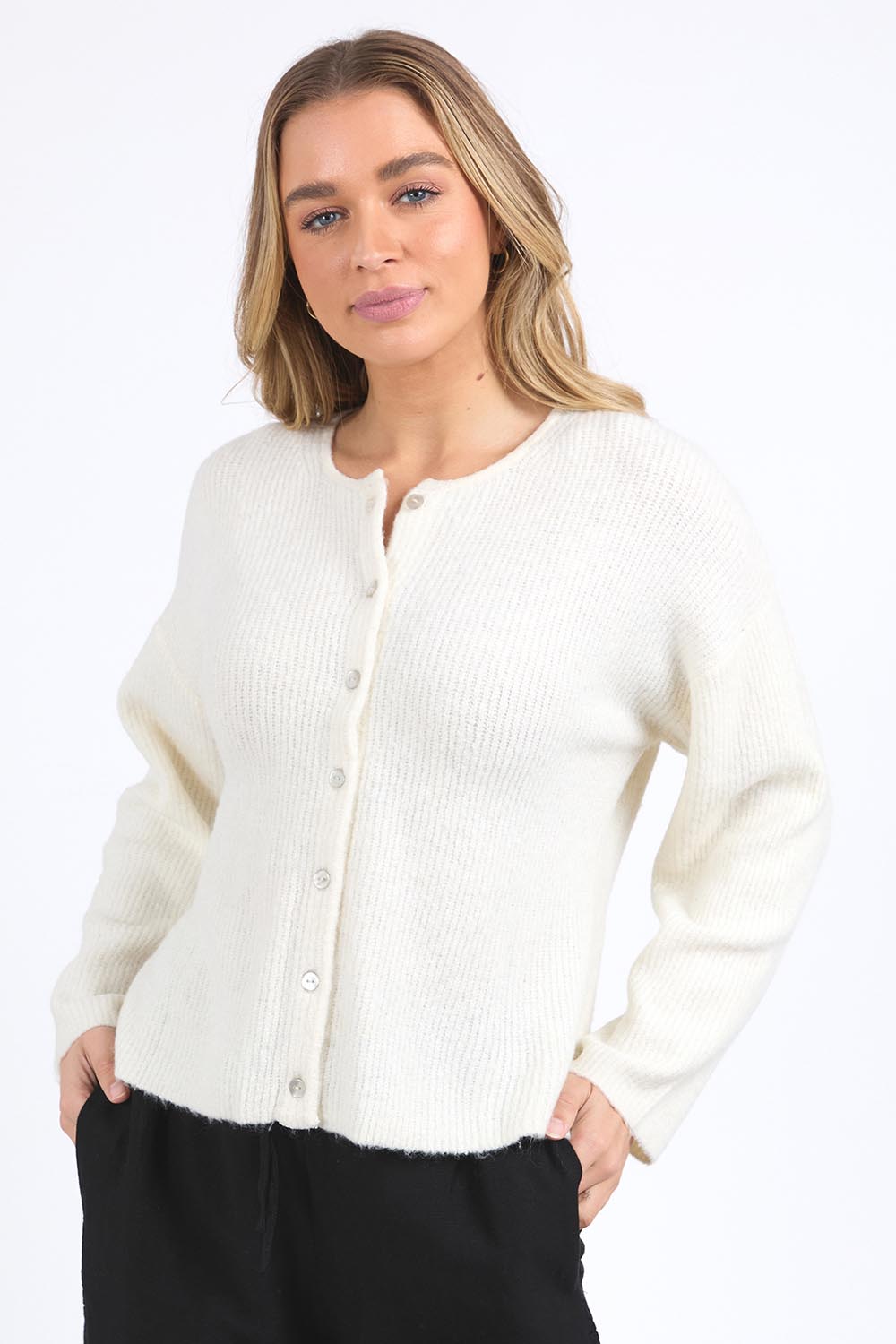 A model wearing the Murphy Knit Cardigan in colour Vinwhite (White), from the front, cropped image