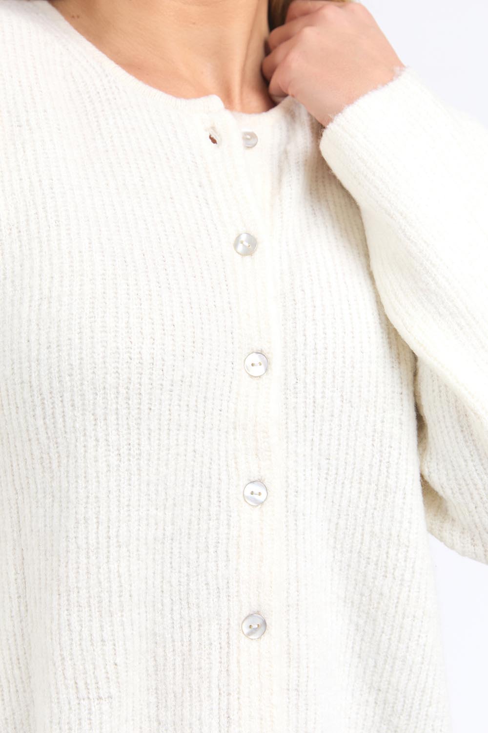 A model wearing the Murphy Knit Cardigan in colour Vinwhite (White), from the front, cropped image