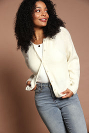 Model Ziara wearing size 10 of the Murphy Knit Cardigan in colour Vinwhite (White), from the front, showing the whole outfit