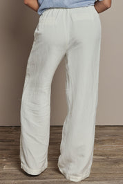 Model Ziara wearing size 10 of the South Linen Blend Pant in colour Vinwhite (White), from the back