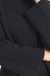 A model wearing the Jude Wool Blend Knit in colour Black (Black), from the front, cropped image