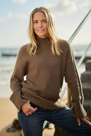 Model Maggie wearing size 10 of the Oliver Knit in colour Coffee, from the front, showing the whole outfit