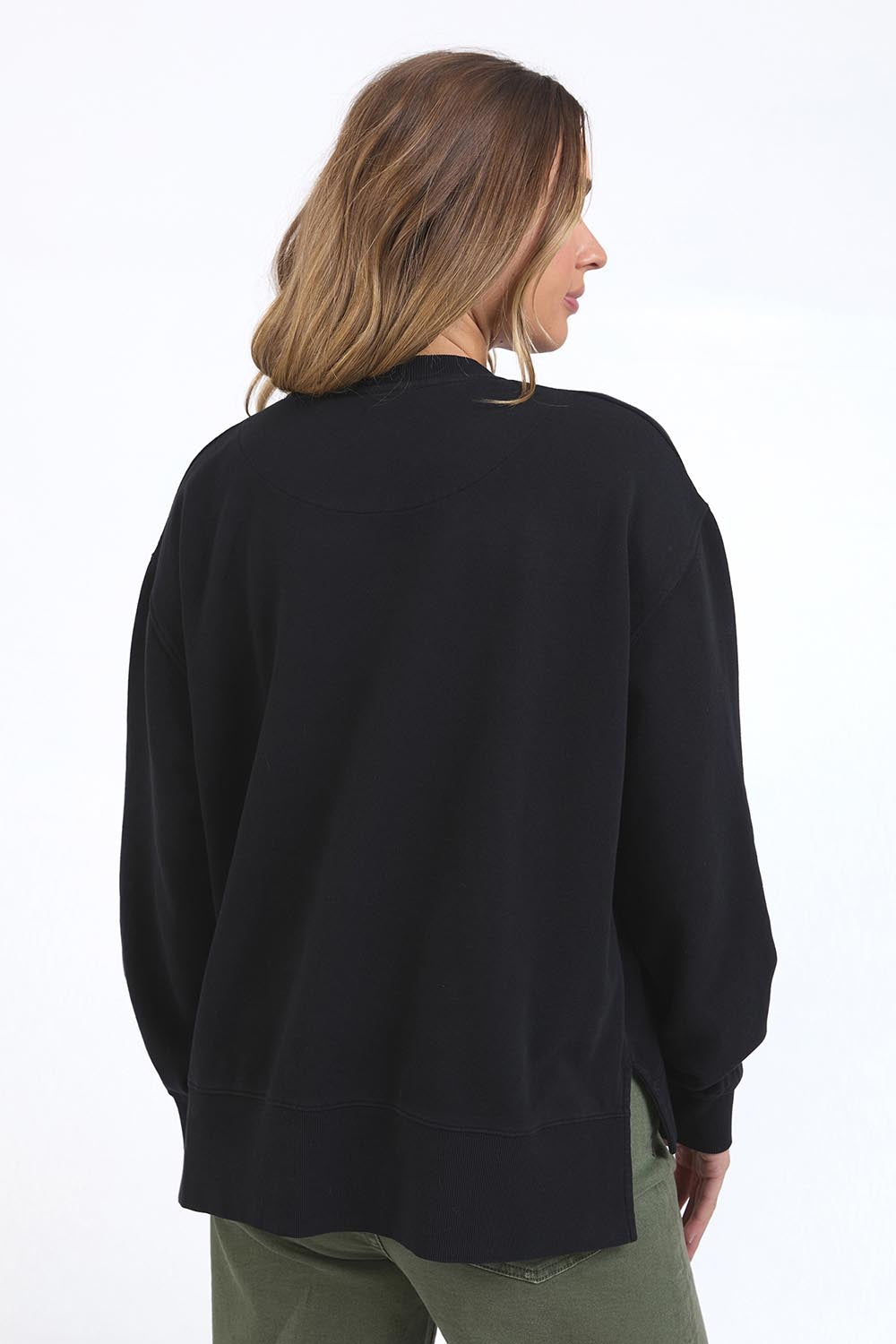 A model wearing the Happiness Cotton Crew in colour Washblack (Black), from the back