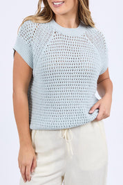 A model wearing the Isla Knit Vest in colour Balladblue (Blue), from the front, cropped image