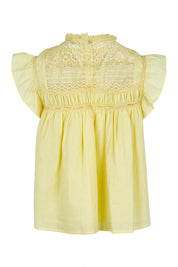 Product shot of the Adelyn Cotton Top in colour Lemon, from the back
