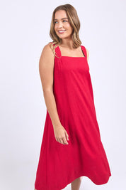 A model wearing the Lourdes Linen Blend Dress in colour Crimson (Red), from the front, cropped image