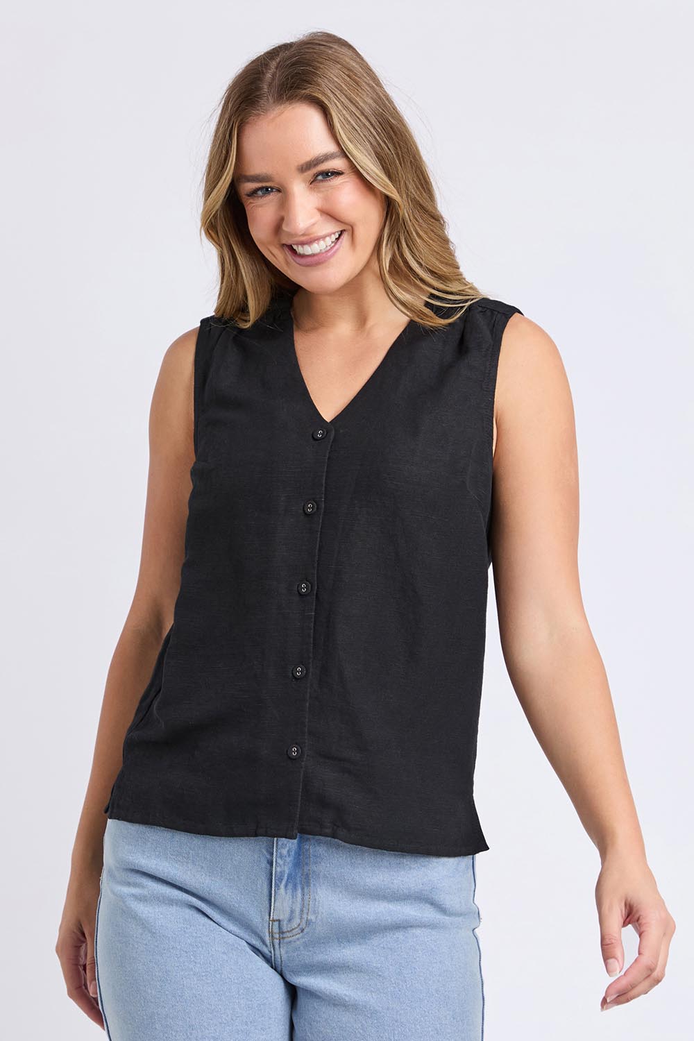 A model wearing the Anara Linen Blend Top in colour Black (Black), from the front, cropped image