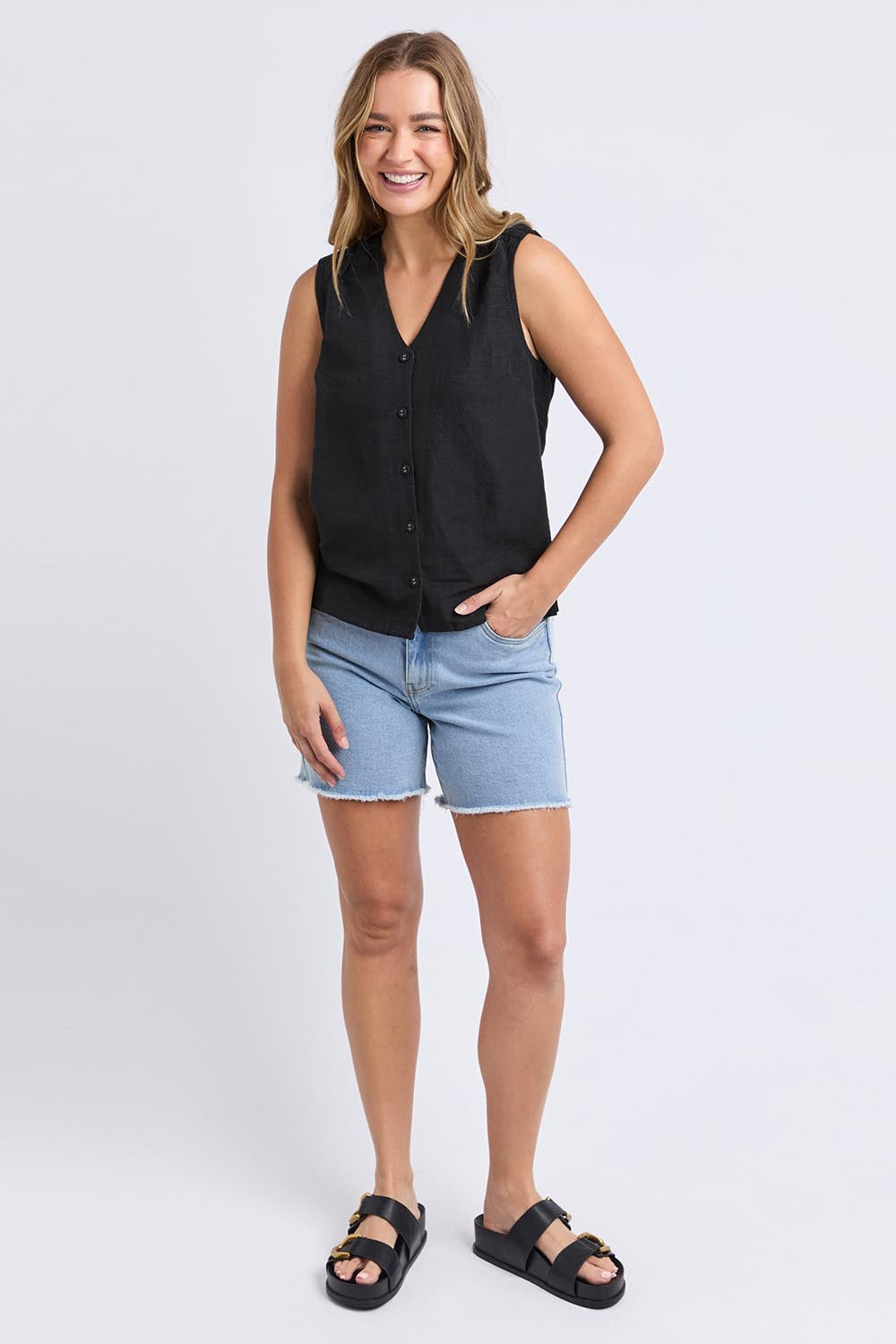 A model wearing the Anara Linen Blend Top in colour Black (Black), from the front, showing the whole outfit