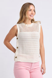 A model wearing the Chilli Cotton Knit Top in colour Vintawhite (White), from the front, cropped image