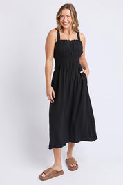 A model wearing the Dandelion Cotton Blend Dress in colour Black (Black), from the front, showing the whole outfit