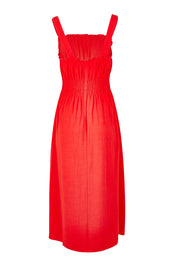 Product shot of the Dandelion Cotton Blend Dress in colour Tangelo, from the back