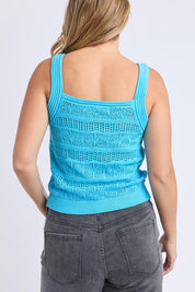 A model wearing the Polperro Cotton Knit Top in colour Azureblue (Blue), from the back