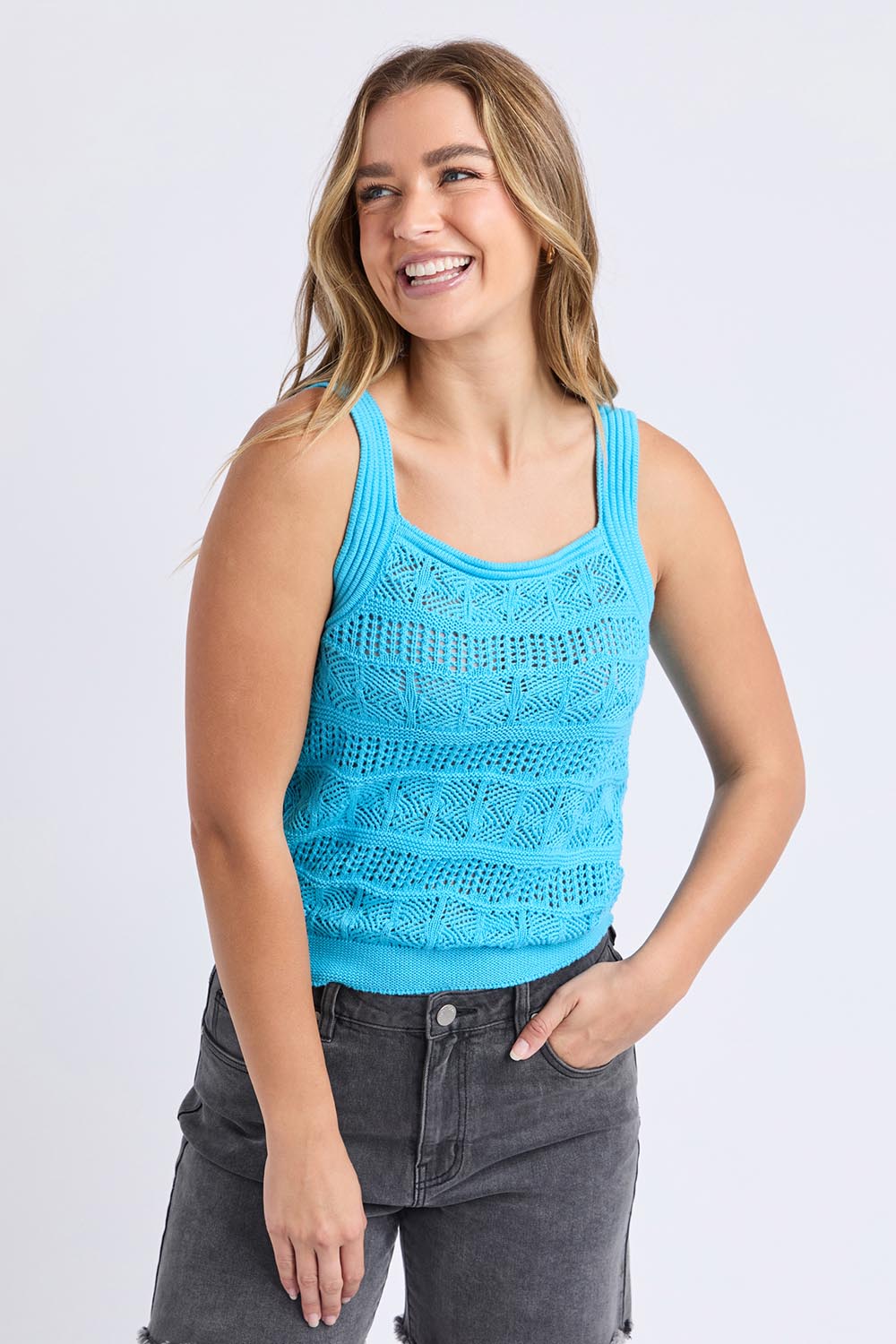 A model wearing the Polperro Cotton Knit Top in colour Azureblue (Blue), from the front, cropped image