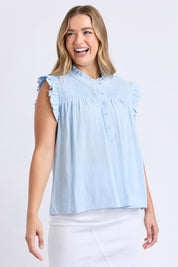 A model wearing the Airlie Cotton Blend Top in colour Crystalblu (Blue), from the front, cropped image