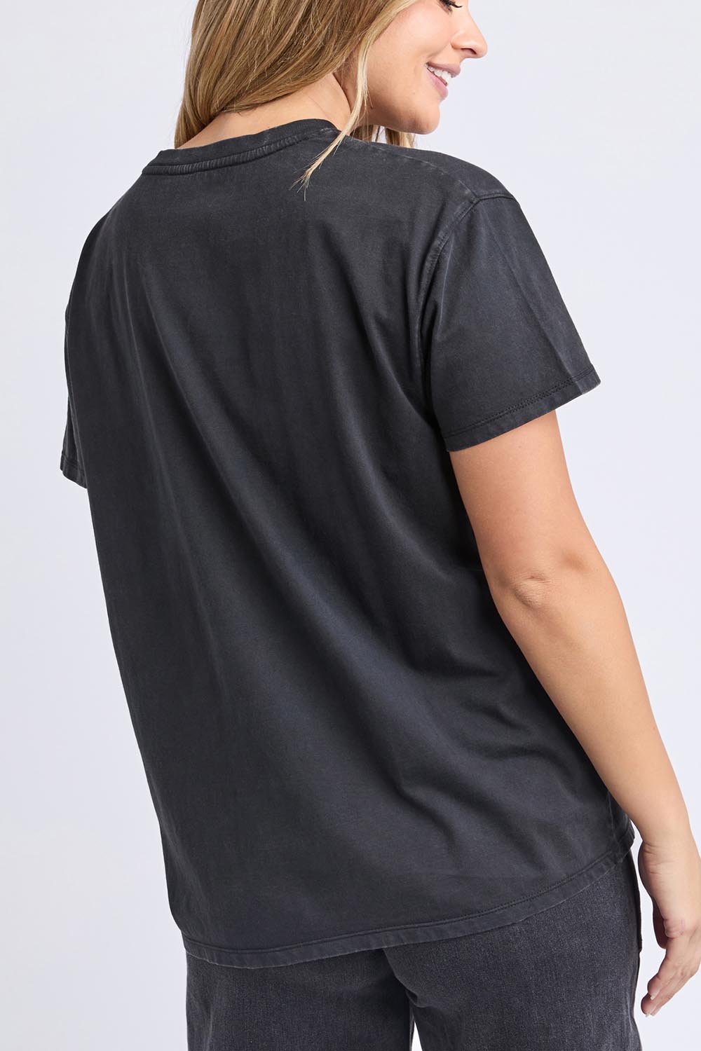 A model wearing the Rodeo Cotton Tee in colour Washedblk (Black), from the back