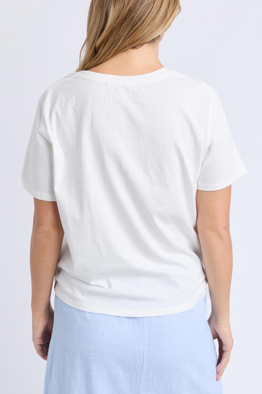 A model wearing the Est 2018 Cotton Tee in colour Vintgwht (White), from the back