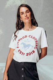 A model wearing the Est 2018 Cotton Tee in colour Vintgwht (White), from the front, showing the whole outfit